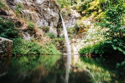 a waterfall in the middle of a river at APARTMENT WALD - im Skigebiet Gerlitzen & Ossiacher See in Bodensdorf