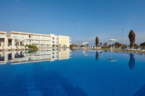 a large swimming pool in front of a hotel at Radisson Blu Resort Saidia Beach in Saidia 