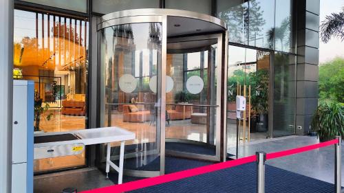 a store front with a large glass door in a building at Novotel Chandigarh Tribune Chowk in Chandīgarh