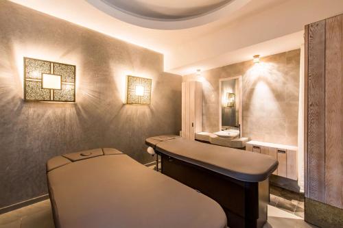 a spa room with a sink and a mirror at Radisson Blu Resort Saidia Beach in Saidia 