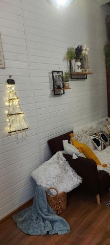 a living room with a christmas tree on the wall at Garden in Satu Mare