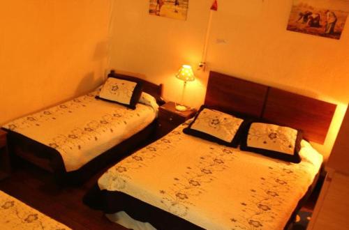 מיטה או מיטות בחדר ב-Hostal Fiorenttina