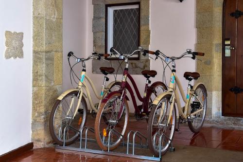 a row of bicycles parked next to each other at Hotel Fortaleza do Guincho Relais & Châteaux in Cascais