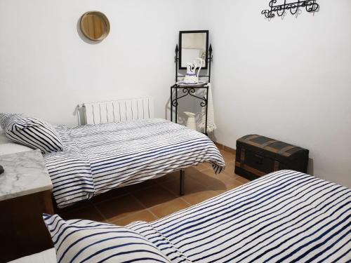 Cama o camas de una habitación en Alojamiento Rural el Seminario