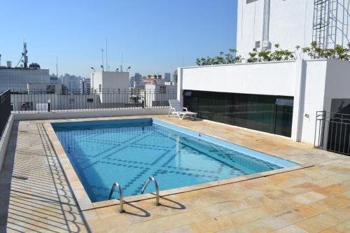 a swimming pool on the roof of a building at Flat Jd Paulista Residence in Sao Paulo