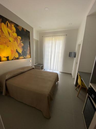 Una cama o camas en una habitación de ILPOSTOGIUSTO