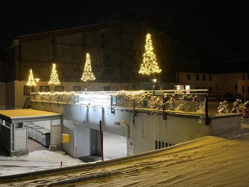a building with christmas trees and lights on it at Apartment Apt A 086 by Interhome in Disentis
