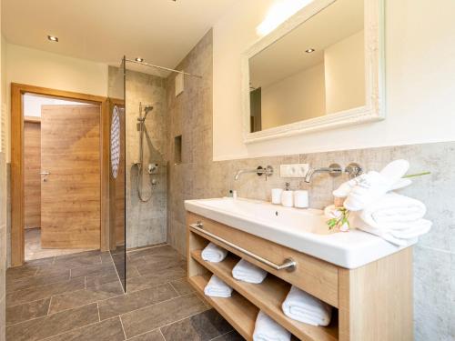 a bathroom with a sink and a shower at Apartment Apart Jasmin by Interhome in Ramsau im Zillertal