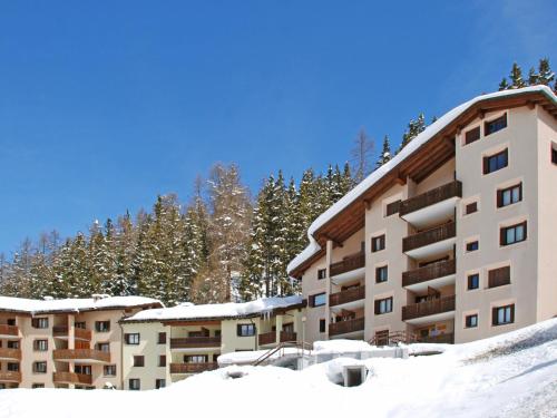 a group of buildings in the snow at Apartment Residenza Chesa Margun 14-7 by Interhome in Surlej