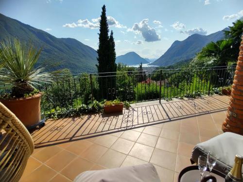 a balcony with a view of the mountains at Holiday Home Villa Massimo by Interhome in Carlazzo