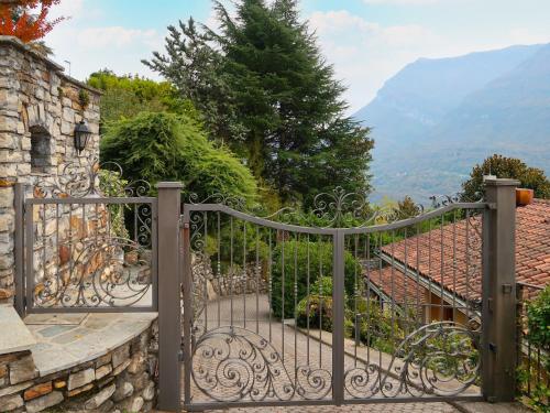an entrance to a house with an iron gate at Holiday Home Villa Massimo by Interhome in Carlazzo