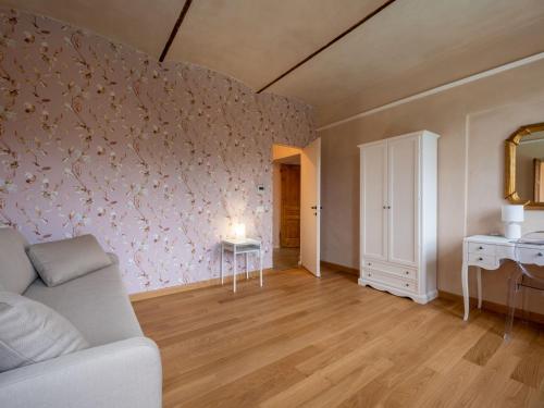 a living room with a couch and a table at Holiday Home Tenuta Margherita by Interhome in Portacomaro