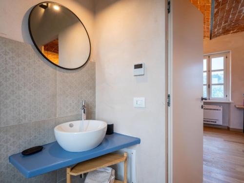 a bathroom with a sink and a mirror at Holiday Home Tenuta Margherita by Interhome in Portacomaro