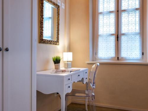 a white desk with a chair and a mirror at Holiday Home Tenuta Margherita by Interhome in Portacomaro