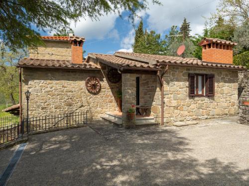 a stone house with a gate in front of it at Holiday Home Capanna by Interhome in San Clemente in Valle