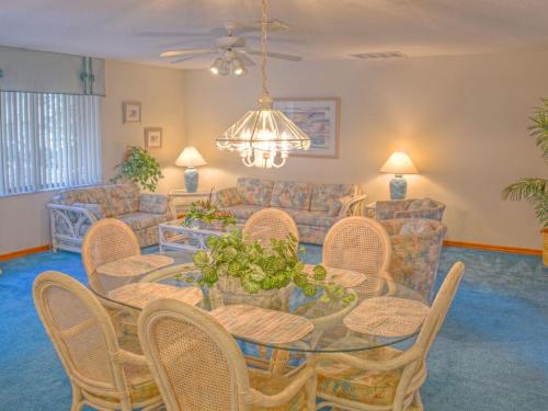 a living room with a table and chairs at Holiday Home Sunrise by Interhome in Palm Coast