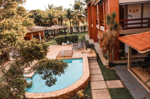 an aerial view of a house with a swimming pool at Pousada e Chale Porto Paraiso in Porto Seguro