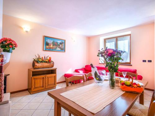 a living room with a table and a couch at Holiday Home Laura by Interhome in Vercana