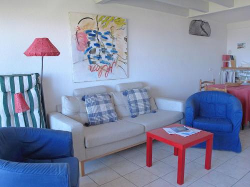 a living room with a couch and two chairs and a table at Apartment Cap Océan by Interhome in Mimizan-Plage
