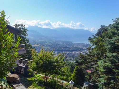 a view of the mountains from a house at Holiday Home Noisette by Interhome in Chardonne