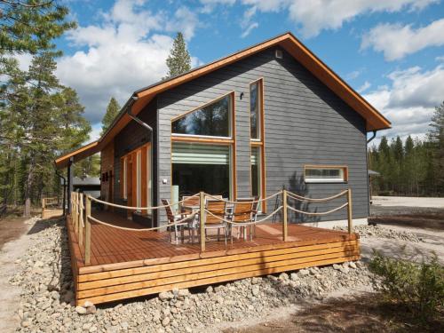 a tiny house with a deck on rocks at Holiday Home Villa biegga by Interhome in Kyrö