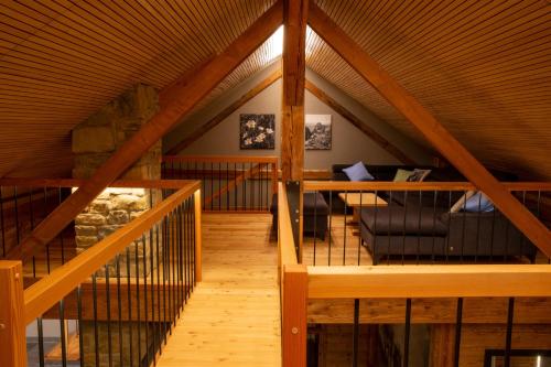 an attic room with a couch and a table at Alpenloft Mereine in Oy-Mittelberg