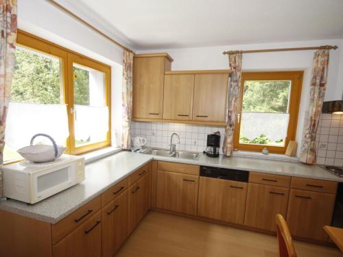 A kitchen or kitchenette at Apartment Familie Hollenders Haus Bergblick by Interhome