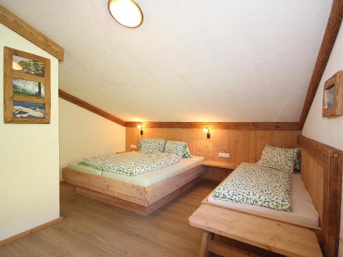 a room with two beds in a attic at Apartment Marina-1 by Interhome in Mühlfeld