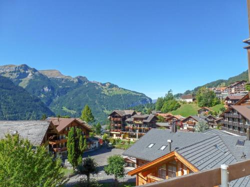 a view of a village with mountains in the background at Apartment Schweizerhof Apt- B by Interhome in Wengen