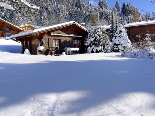 a cabin with snow on the ground in front of it at Chalet Chalet Lorila by Interhome in Villars-sur-Ollon