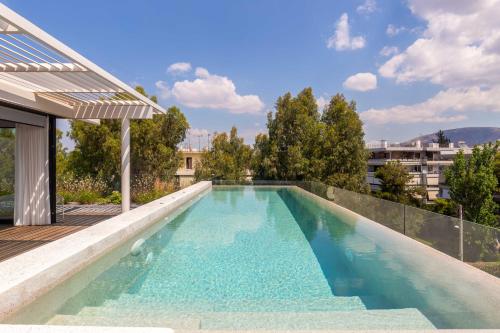 a swimming pool on the roof of a building at Ogarden in Athens
