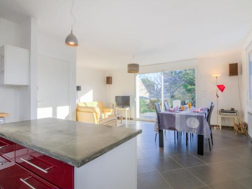 a kitchen and dining room with a table and chairs at Holiday Home Kermahé by Interhome in Saint-Pierre-Quiberon