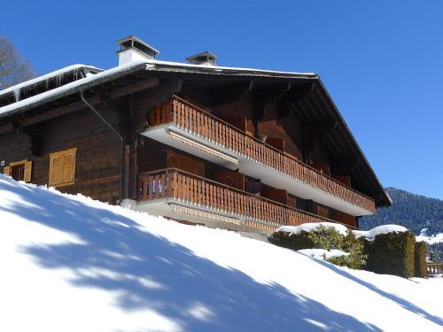 a building with a balcony in the snow at Apartment Les Aiguilles d'Argent 10 by Interhome in Chesières
