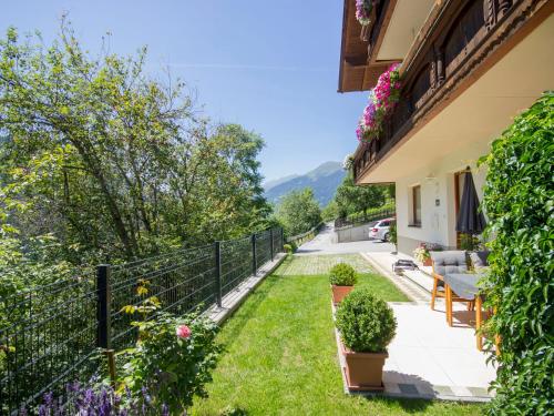 a garden with a fence and some plants at Apartment Venier by Interhome in Kauns