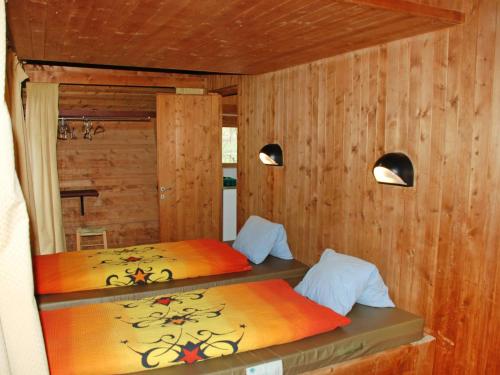 Postel nebo postele na pokoji v ubytování Holiday Home Bosco-TICINO TICKET Inklusive!-5 by Interhome