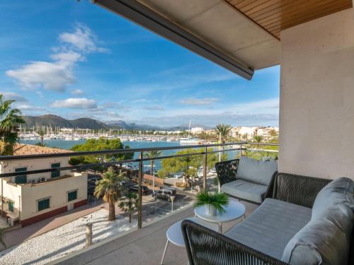 uma varanda com um sofá e vista para um porto em Apartment Portobello Sea Views by Interhome em Port d'Alcudia