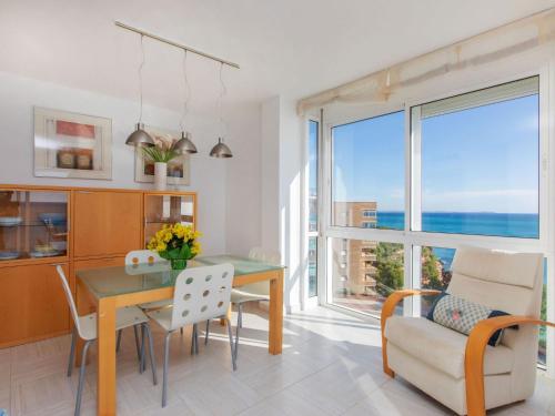 a dining room with a table and chairs and a window at Apartment Gala I-1 by Interhome in Miami Platja