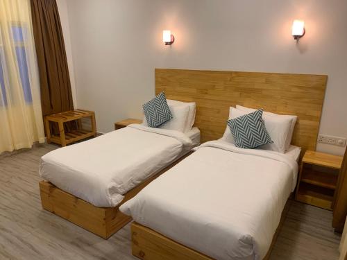 A bed or beds in a room at Sky View by Relax Tours