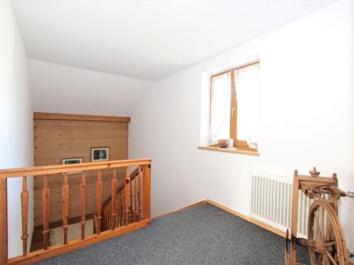 a room with a staircase and a window at Holiday Home Sonnblick by Interhome in Uderns