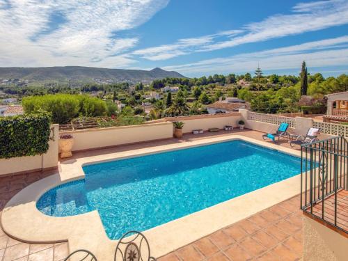 a swimming pool in a villa with a view at Holiday Home Isabelle by Interhome in Jávea