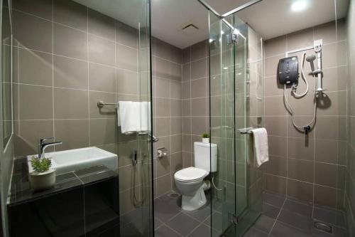 a bathroom with a shower and a toilet and a sink at Aeropod KK Studio Unit 09 Near Airport And City Free Parking in Kota Kinabalu
