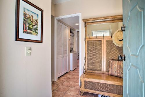 a hallway with a door leading into a room at Quaint Rancho Mirage Condo with Private Patio! in Rancho Mirage