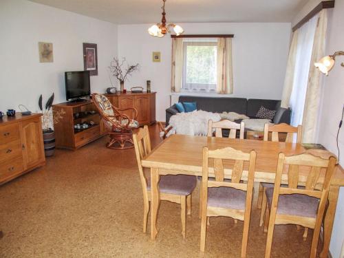 a living room with a wooden table and chairs at Holiday Home Kralovice by Interhome in Nebahovy