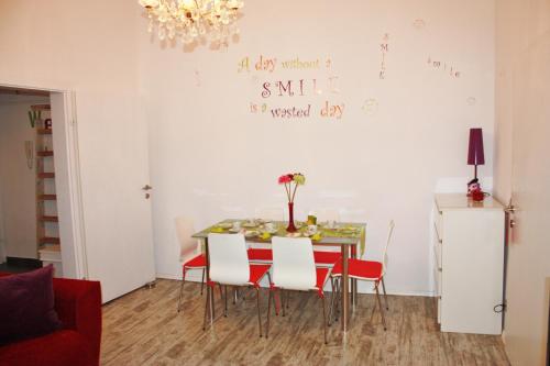 a dining room with a table and chairs at govienna - City Center Apartments in Vienna