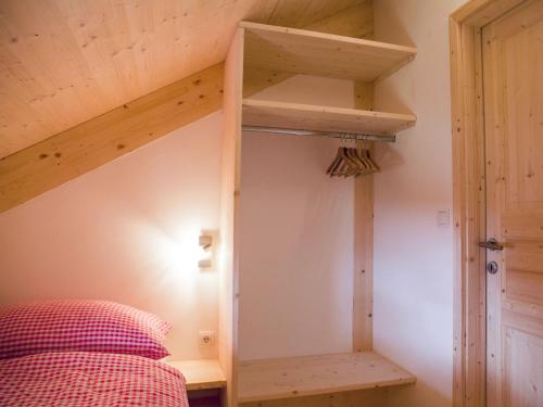 a bedroom with a bunk bed with a ladder at Chalet Klippitzrose by Interhome in Klippitztorl