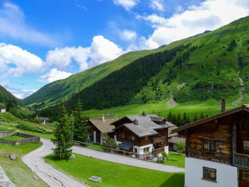 an image of a house in the mountains at Apartment Alpetta by Interhome in Tschamut