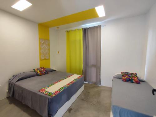 a bedroom with a bed and a window in it at CASA NOVA 2 in São José da Coroa Grande
