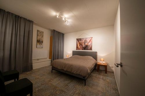 Кровать или кровати в номере Brinkzicht Diever, appartement Coby