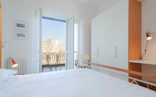A bed or beds in a room at Conca Del Naviglio by Halldis