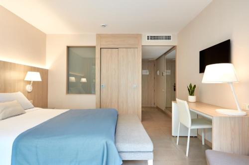 Postel nebo postele na pokoji v ubytování Hotel Omnium